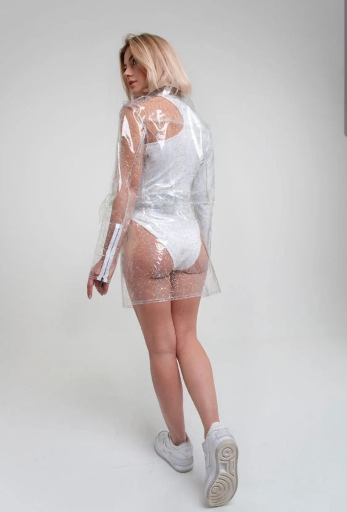 Clear Stylish TPU suit: cropped jacket and the skirt. Transparent vinyl unique clothes. Party clothing.